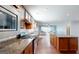 Kitchen features stainless steel appliances, an island, and granite countertops at 104 Conway St, Peachtree City, GA 30269
