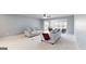 Living area features neutral tones and plush carpeting at 104 Conway St, Peachtree City, GA 30269