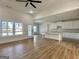 Inviting living room flows into kitchen, boasting wood floors and ample natural light at 6149 Se Pinewood Dr, Covington, GA 30014