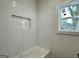 Shower features white subway tiles and a built-in niche at 6149 Se Pinewood Dr, Covington, GA 30014