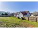 Spacious, well-maintained backyard featuring a wooden fence and lush green lawn, perfect for outdoor activities and relaxation at 39 Thorne Berry Dr, Hampton, GA 30228