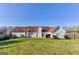 Wide backyard featuring a lush lawn, a patio and mature trees at 39 Thorne Berry Dr, Hampton, GA 30228
