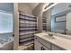 Bathroom featuring a shower with blue and gray striped curtain, bathtub and vanity with a mirror at 39 Thorne Berry Dr, Hampton, GA 30228