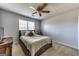 Neutral bedroom features a ceiling fan, cozy carpet and lots of natural light at 39 Thorne Berry Dr, Hampton, GA 30228