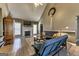 Comfortable living room with a white fireplace, a mounted TV, vaulted ceilings, and a decorative wreath at 39 Thorne Berry Dr, Hampton, GA 30228