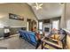 Cozy living room featuring vaulted ceilings, a brick-look tile floor, and warm, neutral wall colors at 39 Thorne Berry Dr, Hampton, GA 30228