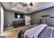 Well-lit main bedroom featuring a king-size bed, neutral walls, and a wall-mounted TV at 39 Thorne Berry Dr, Hampton, GA 30228