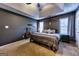 Cozy main bedroom featuring a plush king bed, neutral walls, and a large window for natural light at 39 Thorne Berry Dr, Hampton, GA 30228
