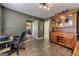 Home office with adjacent dining area, tiled floors, and lots of natural light at 39 Thorne Berry Dr, Hampton, GA 30228