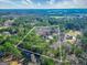 Stunning aerial view of a property showcasing its expansive 5+ acres of land with approximate lot lines and mature trees at 3140 Cox Cemetery Rd, Social Circle, GA 30025