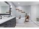 Elegant bathroom with soaking tub, double vanity, and a separate tiled shower, creating a spa-like retreat at 3140 Cox Cemetery Rd, Social Circle, GA 30025