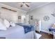 Nautical themed bedroom with white furniture, ceiling fan and beach-themed decor at 3140 Cox Cemetery Rd, Social Circle, GA 30025