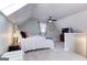 Lofted bedroom featuring a ceiling fan, sloped ceilings and neutral decor at 3140 Cox Cemetery Rd, Social Circle, GA 30025