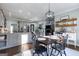 Open dining area with dark wood table, flowing into the kitchen and living spaces at 3140 Cox Cemetery Rd, Social Circle, GA 30025