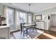 Bright dining area with natural light, stylish furnishings, and hardwood floors at 3140 Cox Cemetery Rd, Social Circle, GA 30025