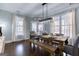 Dining area featuring hardwood floors and large windows providing abundant natural light at 3140 Cox Cemetery Rd, Social Circle, GA 30025