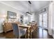 Spacious dining room with hardwood floors, stylish furnishings, and ample natural light at 3140 Cox Cemetery Rd, Social Circle, GA 30025