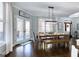 Bright dining room with hardwood floors and access to an outdoor deck or patio at 3140 Cox Cemetery Rd, Social Circle, GA 30025