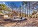 Picture of fire pit with adirondack chairs set in a wooded area at 3140 Cox Cemetery Rd, Social Circle, GA 30025