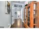 Hallway with hardwood floors, french doors and decorative wooden cabinet at 3140 Cox Cemetery Rd, Social Circle, GA 30025