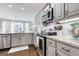 Bright kitchen with granite countertops, stainless steel appliances, and plenty of cabinet space at 3140 Cox Cemetery Rd, Social Circle, GA 30025
