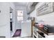 Bright laundry room featuring shiplap walls, modern washer/dryer, and stylish decor at 3140 Cox Cemetery Rd, Social Circle, GA 30025