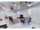 Spacious living area with modern decor, corrugated metal ceiling, ceiling fans, and plenty of seating at 3140 Cox Cemetery Rd, Social Circle, GA 30025