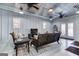 Bright living space with modern furnishings, French doors, and an adjacent kitchenette at 3140 Cox Cemetery Rd, Social Circle, GA 30025