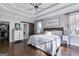 The primary bedroom boasts a tray ceiling, hardwood floors, and an ensuite bathroom at 3140 Cox Cemetery Rd, Social Circle, GA 30025