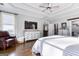The primary bedroom features a tray ceiling, hardwood floors, walk in closet and abundant natural light at 3140 Cox Cemetery Rd, Social Circle, GA 30025