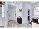 Well-lit mudroom with white shiplap walls and herringbone flooring, and access to the laundry room at 3140 Cox Cemetery Rd, Social Circle, GA 30025