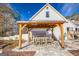 Covered outdoor patio featuring a dining table and chairs, perfect for dining and enjoying outdoor living space at 3140 Cox Cemetery Rd, Social Circle, GA 30025