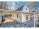 Side view of a white pool house shows ample covered parking and a covered outdoor seating area at 3140 Cox Cemetery Rd, Social Circle, GA 30025