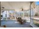 Relaxing porch featuring comfortable seating, a ceiling fan, and views of the surrounding landscape at 3140 Cox Cemetery Rd, Social Circle, GA 30025