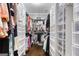 Walk-in closet with custom shelving and storage, perfect for organizing clothes and accessories at 3140 Cox Cemetery Rd, Social Circle, GA 30025