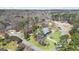 Aerial view of the property in a neighborhood featuring mature trees and well-maintained yards at 122 Lawn Market, Sharpsburg, GA 30277