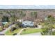Aerial view of home featuring well-manicured lawn, mature trees, and circular driveway at 122 Lawn Market, Sharpsburg, GA 30277