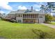 Expansive backyard featuring a screened porch, deck, and well-maintained lawn, ideal for outdoor entertaining at 122 Lawn Market, Sharpsburg, GA 30277