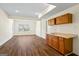 Finished basement area with wood flooring and wet bar, perfect for entertaining at 122 Lawn Market, Sharpsburg, GA 30277