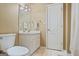 Small bathroom with a toilet, vanity, and a linen closet at 122 Lawn Market, Sharpsburg, GA 30277