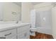 Bright bathroom with white vanity, and shower with curtain, offering a clean and functional space at 122 Lawn Market, Sharpsburg, GA 30277