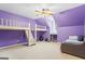 Spacious bedroom with unique built-in bunk beds, study nook, and ceiling fan for a fun and functional space at 122 Lawn Market, Sharpsburg, GA 30277