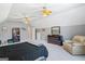 Large bedroom with vaulted ceilings, ceiling fans, and comfortable seating at 122 Lawn Market, Sharpsburg, GA 30277