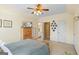 Cozy bedroom featuring hardwood furniture, and doorway to the ensuite bathroom at 122 Lawn Market, Sharpsburg, GA 30277