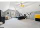 Large bedroom with vaulted ceilings, ceiling fans, and a comfortable sitting area at 122 Lawn Market, Sharpsburg, GA 30277