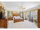 Large main bedroom with natural light, ensuite and wood furniture at 122 Lawn Market, Sharpsburg, GA 30277