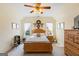 Inviting bedroom with hardwood furniture set, natural light, and charming décor at 122 Lawn Market, Sharpsburg, GA 30277