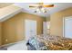 Bedroom with sloped ceilings, ceiling fan, and access to other rooms at 122 Lawn Market, Sharpsburg, GA 30277
