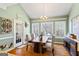 Bright dining room with large windows, a vaulted ceiling and hardwood floors at 122 Lawn Market, Sharpsburg, GA 30277