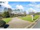Charming home featuring a well-maintained lawn, mature trees, and welcoming curb appeal at 122 Lawn Market, Sharpsburg, GA 30277